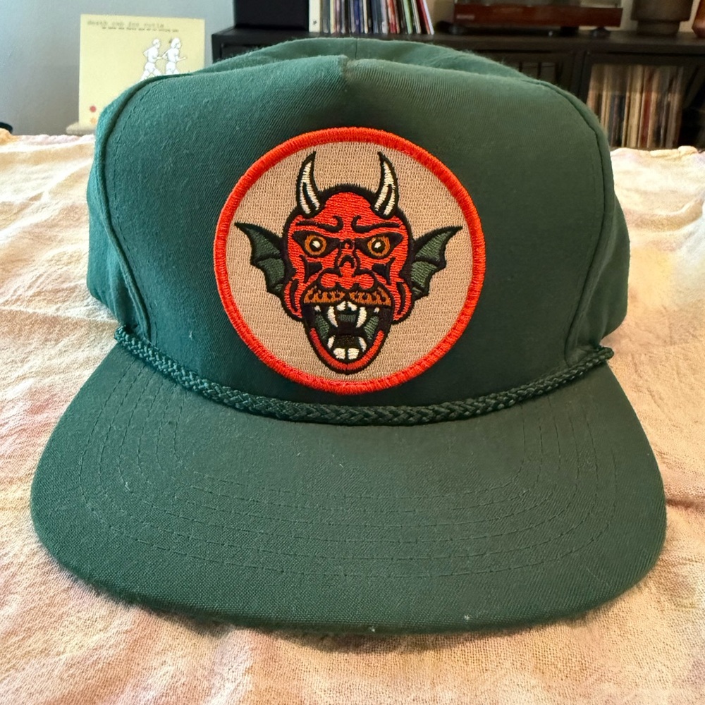 Indestructible Mfg Co DEVIL RIDER SNAPBACK green golf cap with red patch